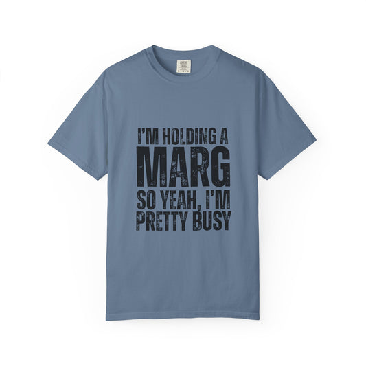 Blue t-shirt with black text reading 'I'm holding a marg so yeah, I'm pretty busy'