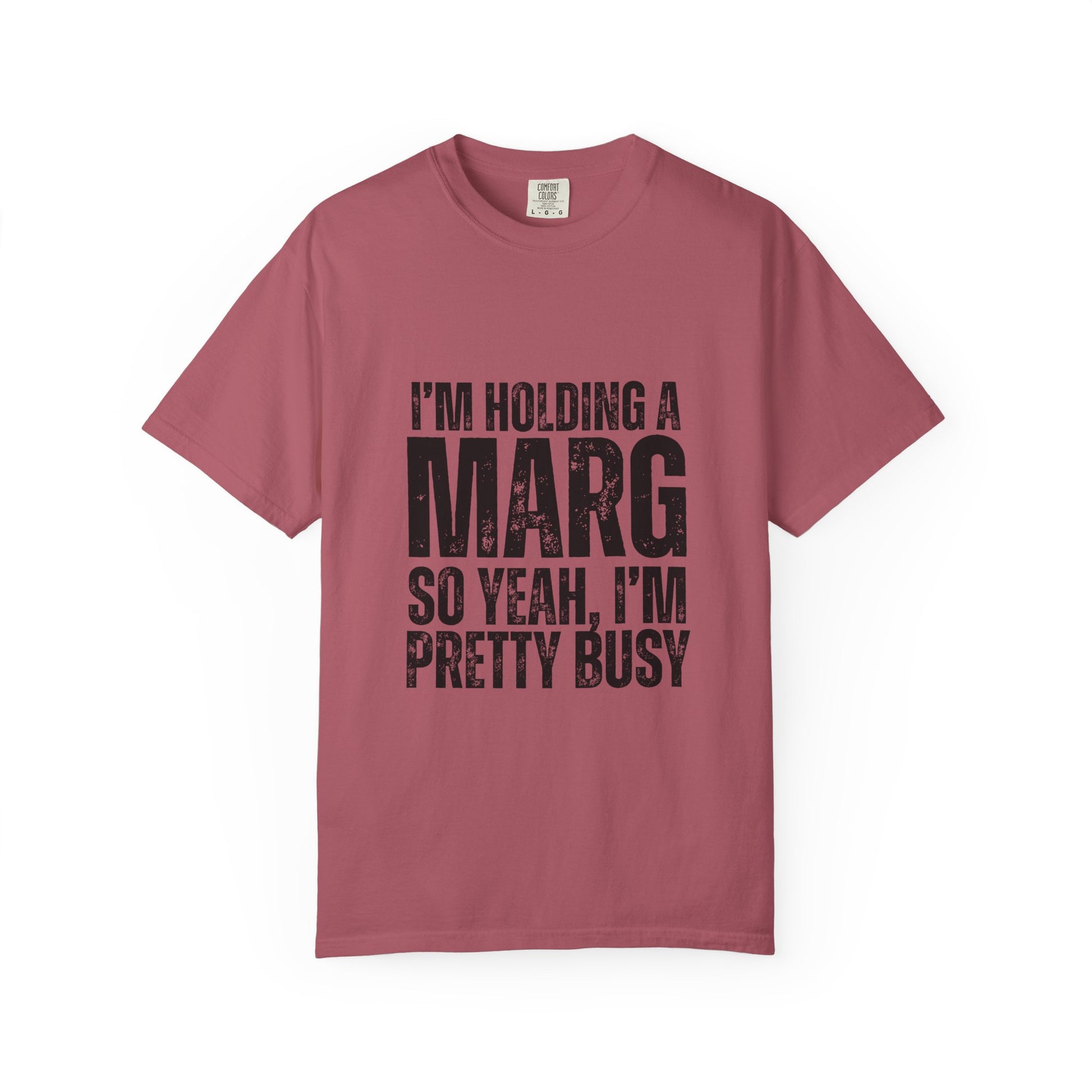 Pink t-shirt with black text reading 'I'm holding a marg so yeah, I'm pretty busy'
