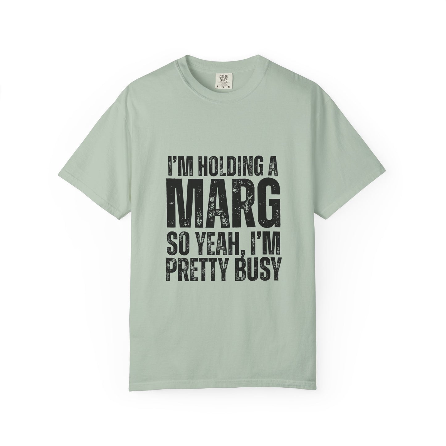 Light green t-shirt with black text reading 'I'm holding a marg so yeah, I'm pretty busy'