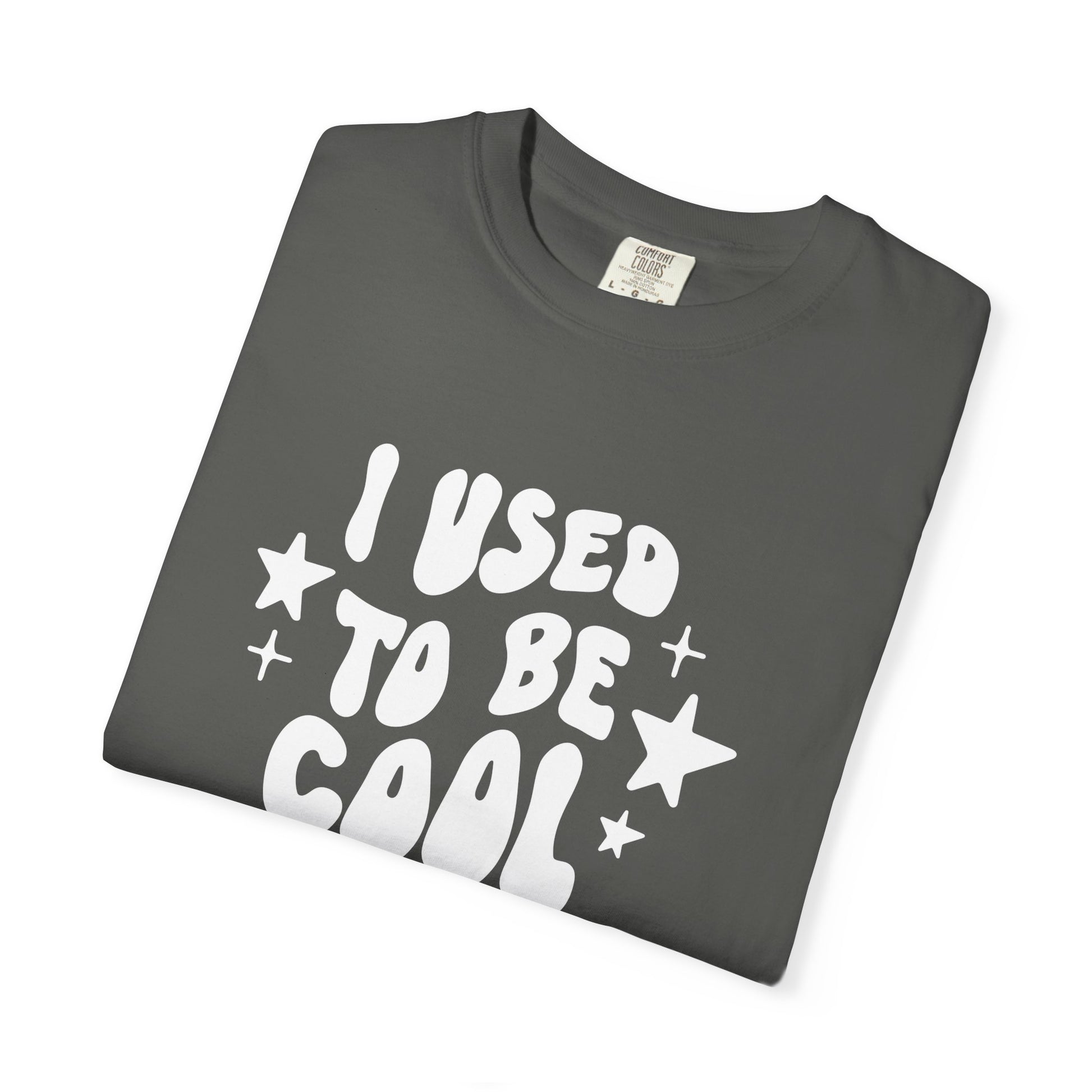 Folded gray t-shirt with white text 'I USED To Be Cool' on a white background