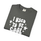 Folded gray t-shirt with white text 'I USED To Be Cool' on a white background