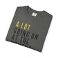 Folded gray t-shirt with yellow and black text on a white background