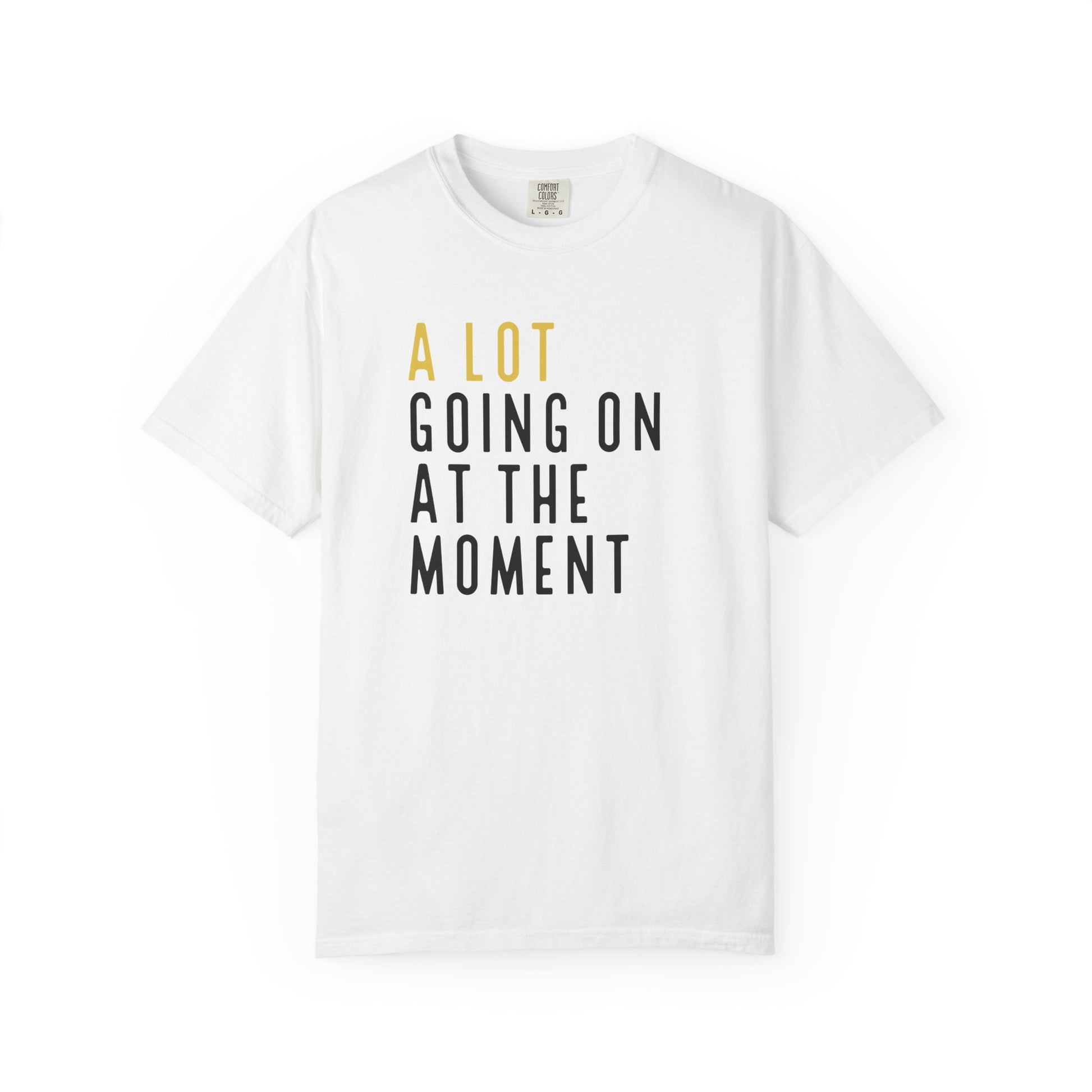 White t-shirt with text 'A LOT GOING ON AT THE MOMENT' on a white background