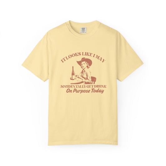 Yellow shirt with a cowgirl and text that says 'It looks like I may accidentally get drunk on purpose today' 