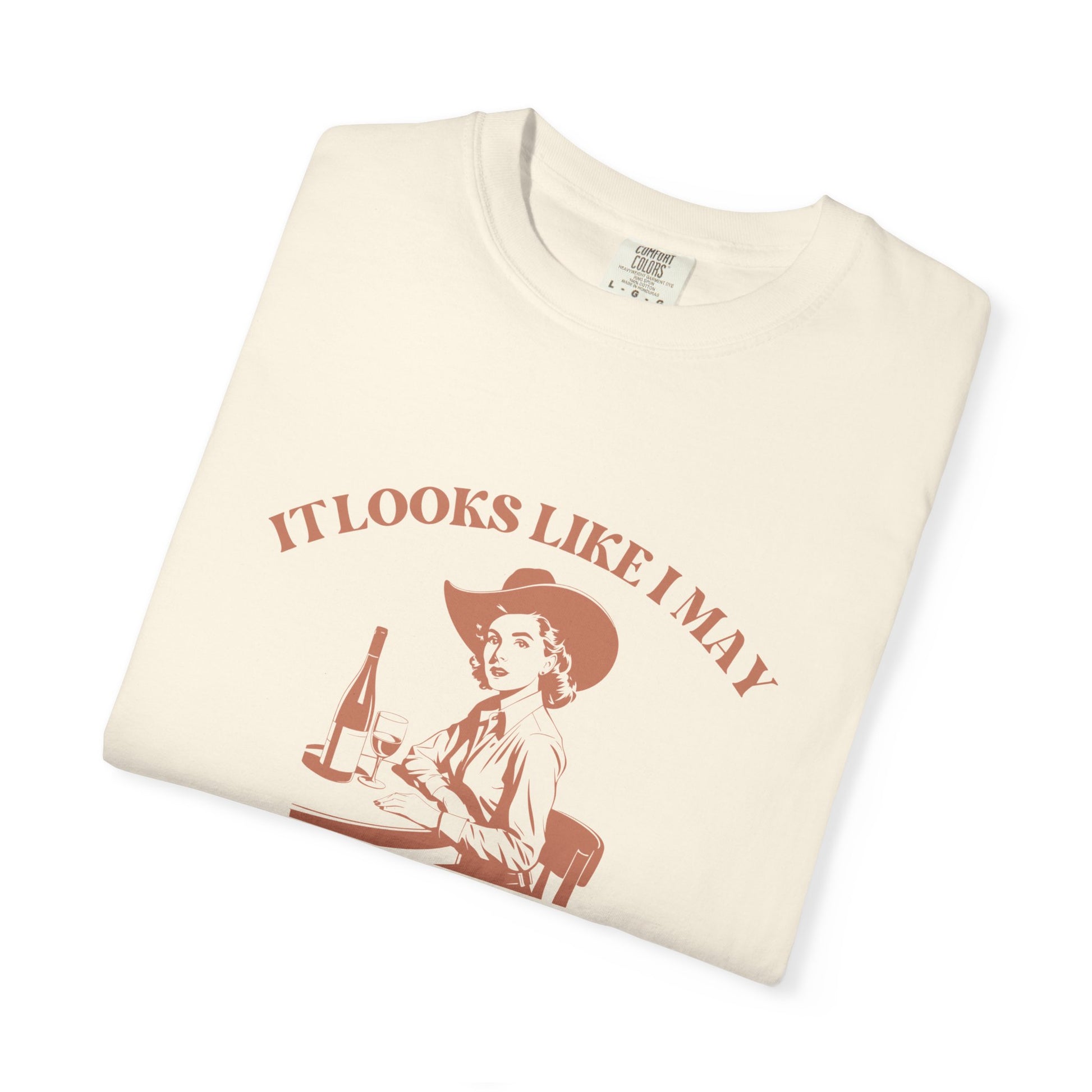 Folded cream-colored t-shirt with a graphic and text 