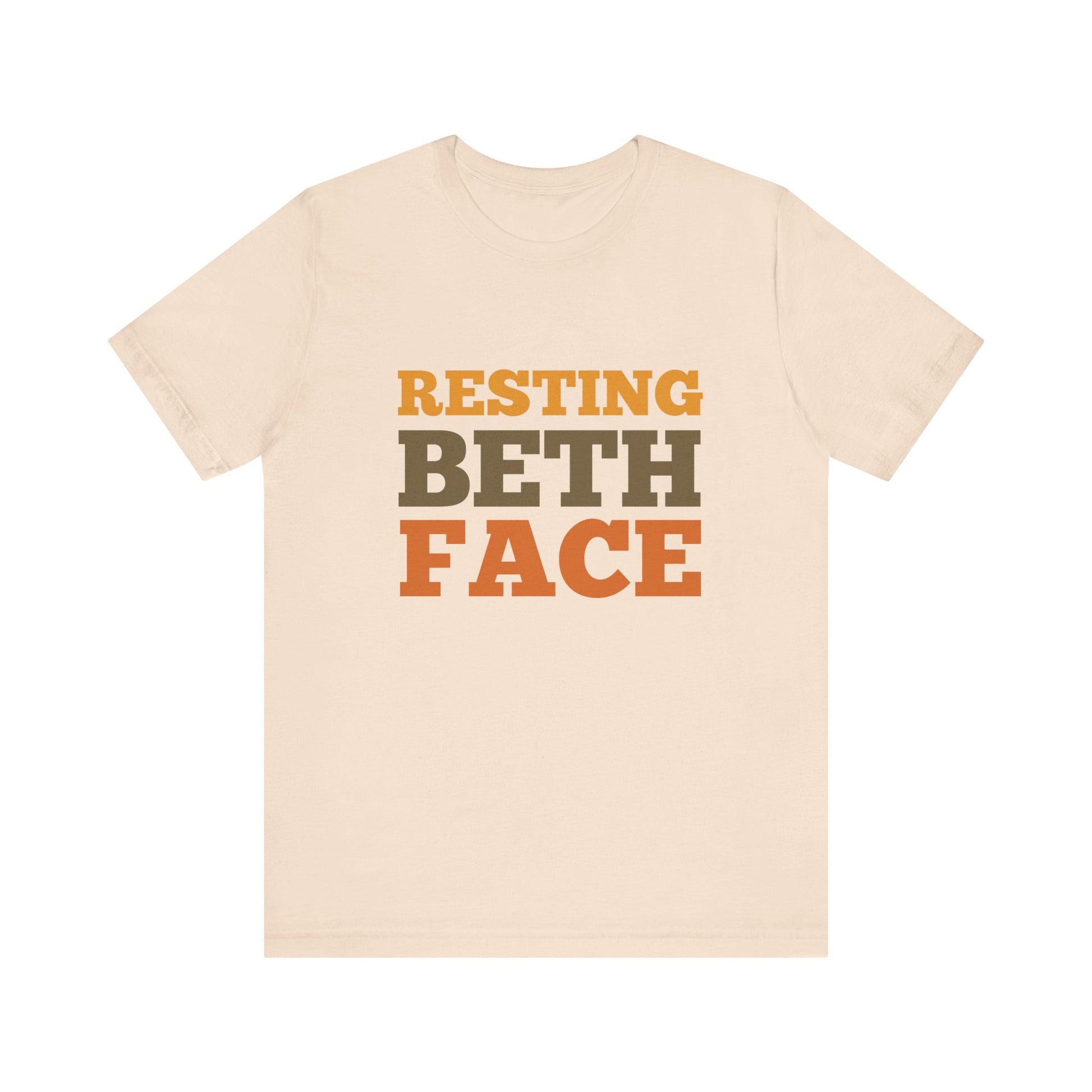 Beige t-shirt with 'RESTING BETH FACE' text in brown and black on a white background