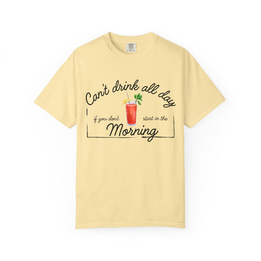 Yellow shirt with a graphic of a Bloody Mary and text that reads 'can't drink all day if you don't start in the morning'