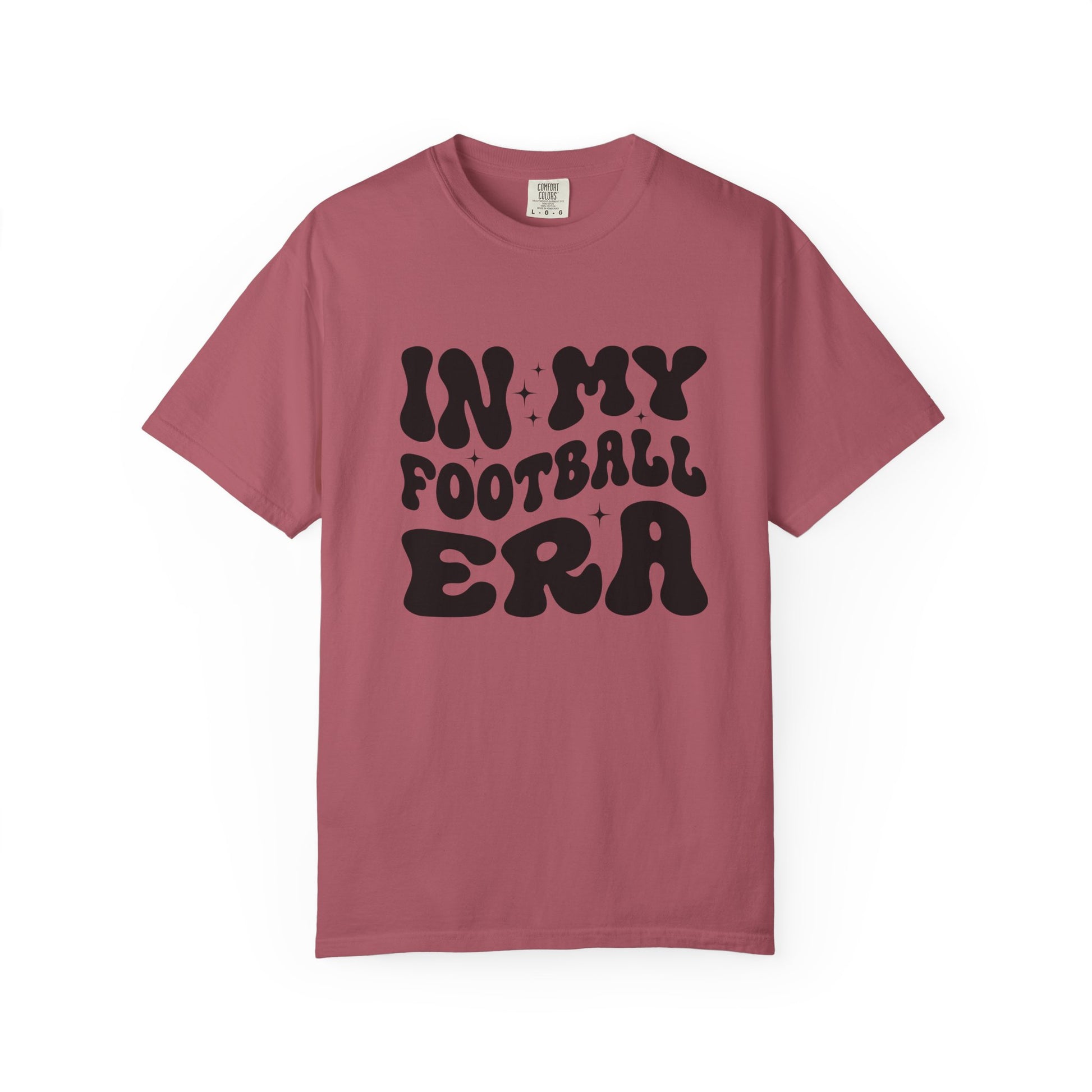 Pink t-shirt with 'IN MY FOOTBALL ERA' text on a white background
