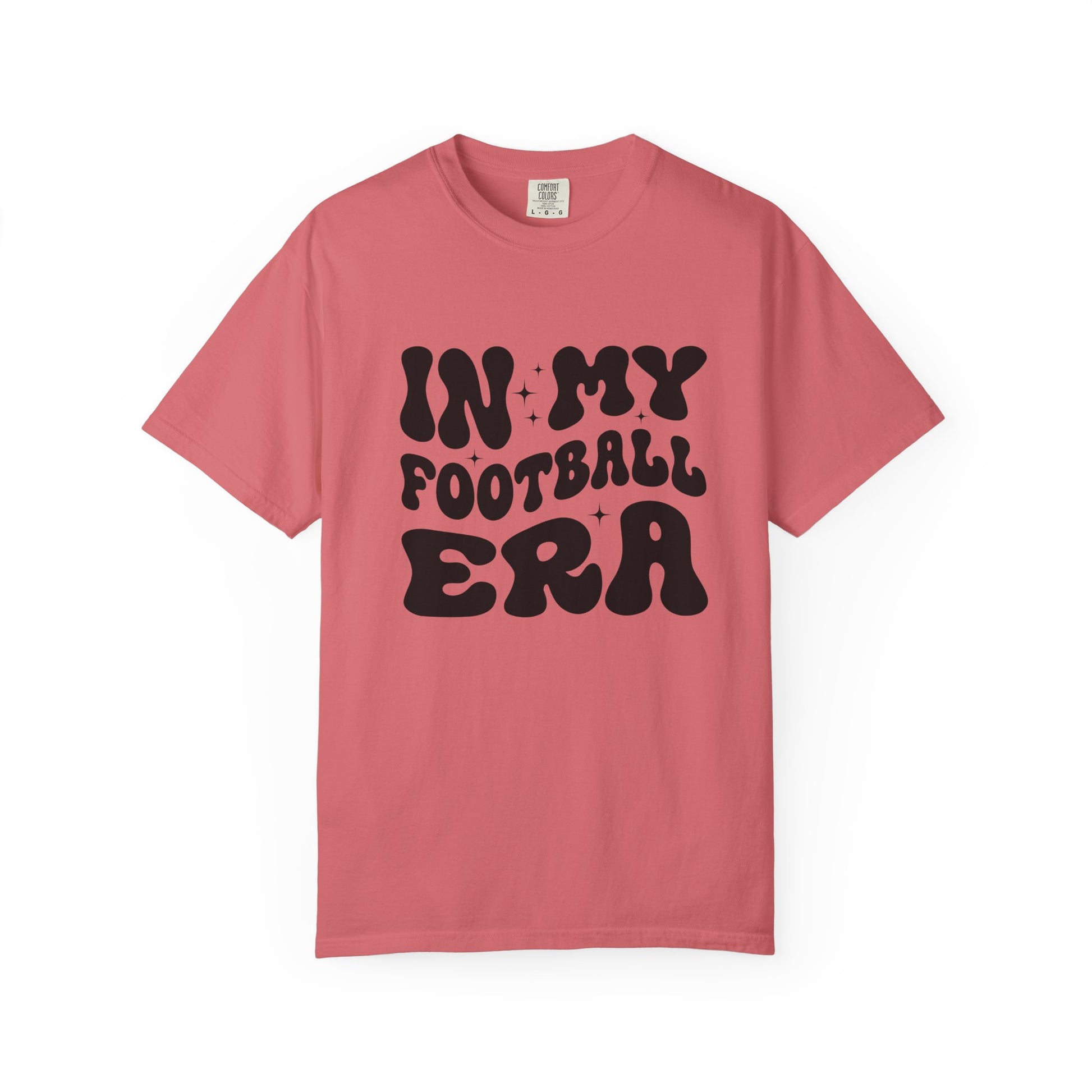 Pink t-shirt with 'IN MY FOOTBALL ERA' text on a white background