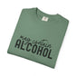 Folded green t-shirt with 'may contain ALCOHOL' text 