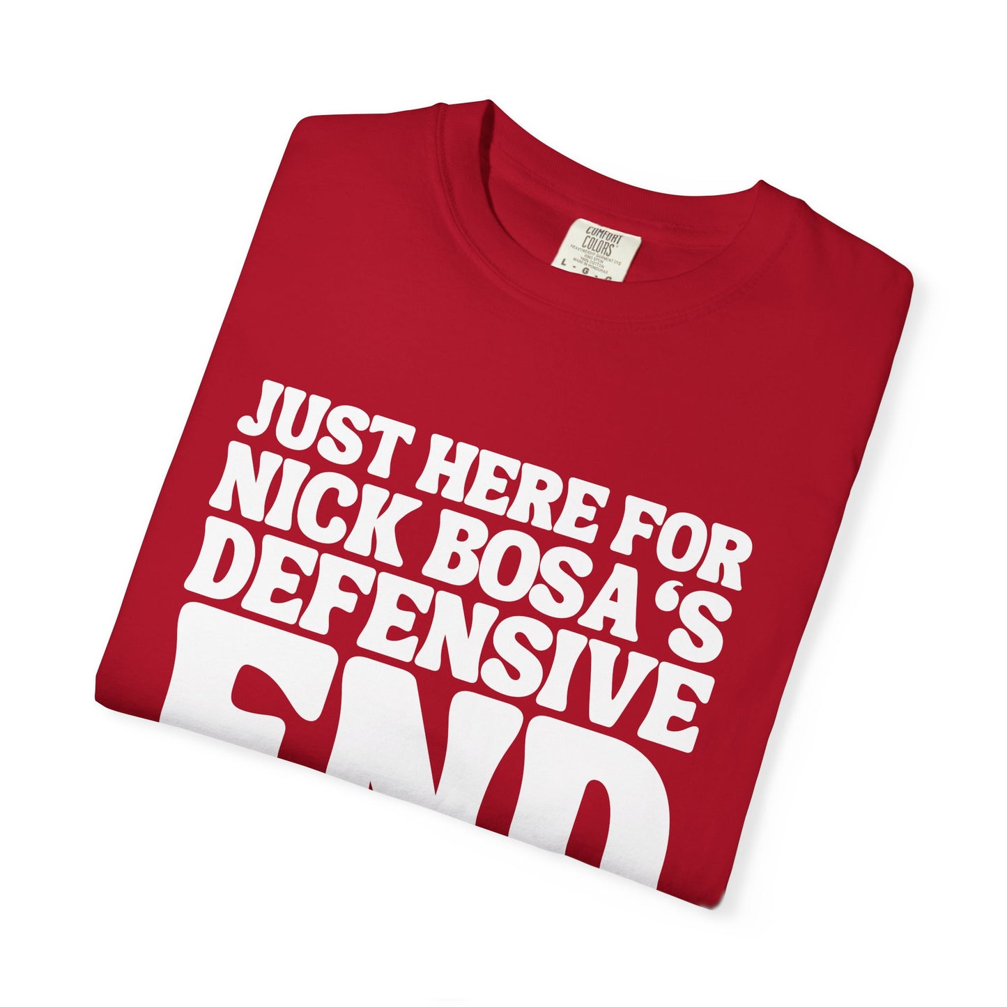 Folded red t-shirt with white text