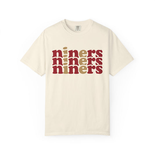 Beige t-shirt with 'niners' text in red and brown on a white background