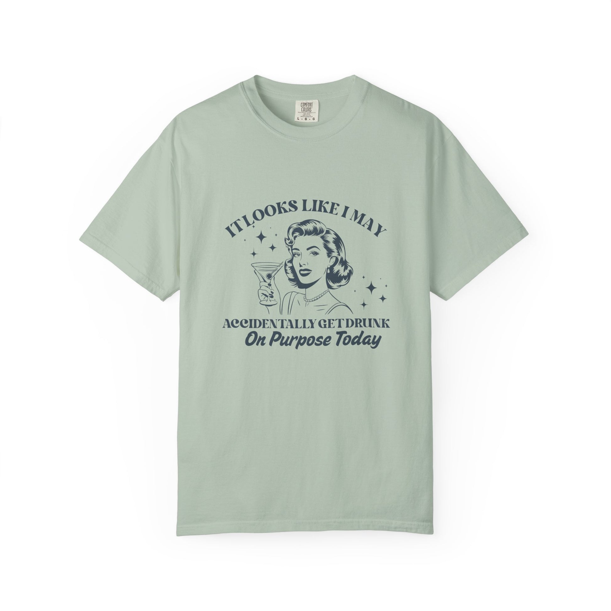 Light green t-shirt with a woman holding a martini and text that says 'It looks like I may accidentally get drunk on purpose today'