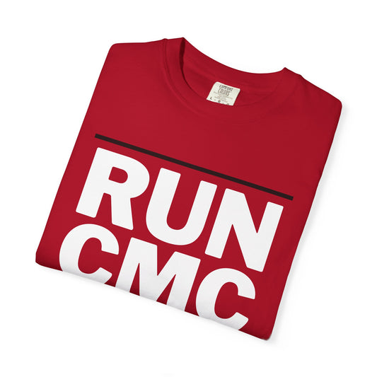 Folded red t-shirt with 'RUN CMC' text on a white background