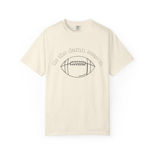 Beige t-shirt with football graphic and text on a white background