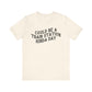Beige t-shirt with 'could be a train station kinda day' in black text on a white background